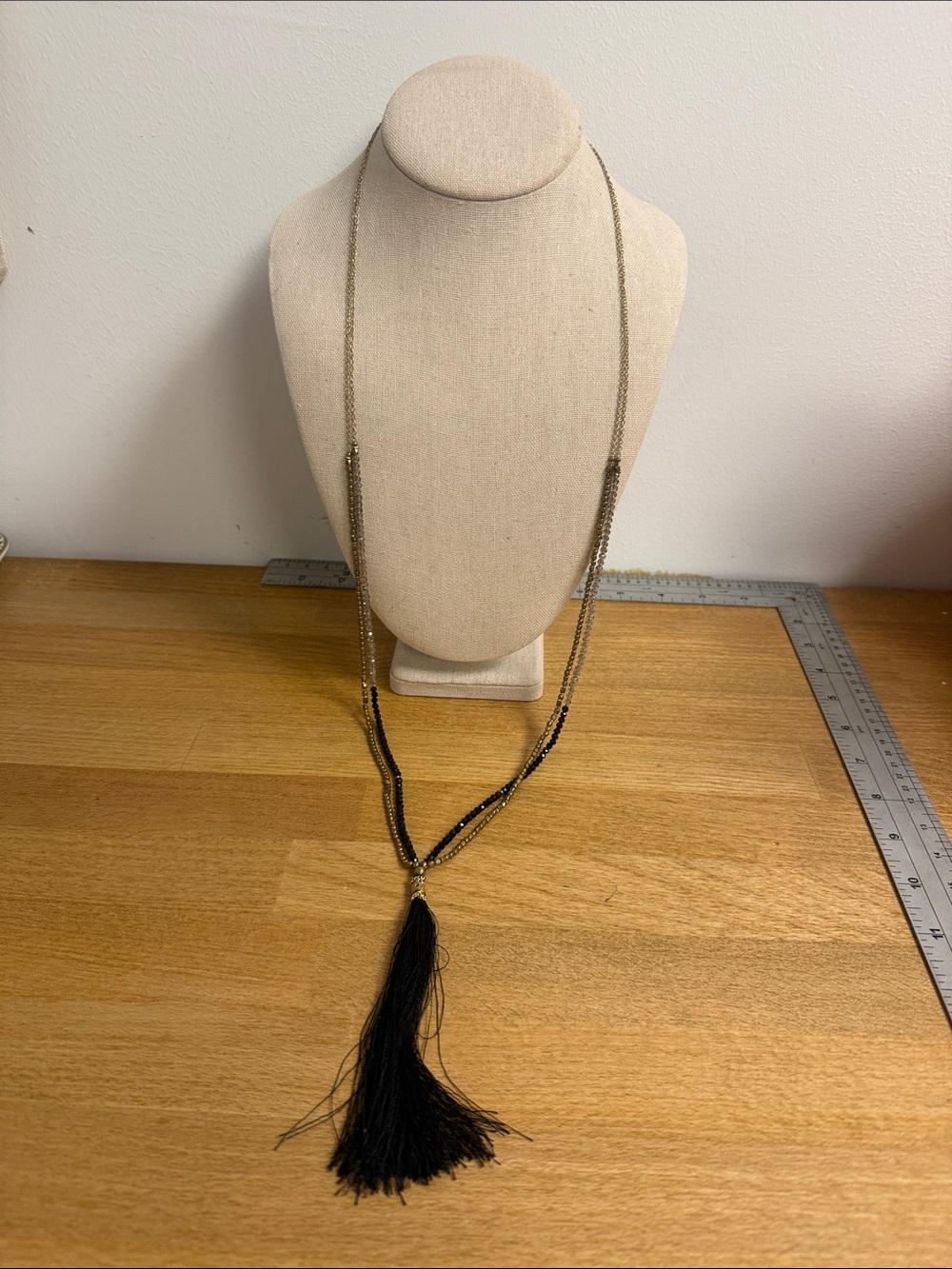 Nakamol gold tone layered seed bead rhinestone necklace with black string tassel